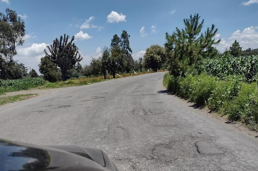 El camino a Chiautzingo es inseguro y está lleno de baches